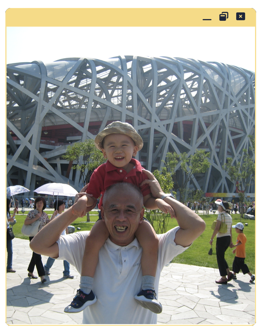 Photo of me on my grandpa's shoulder